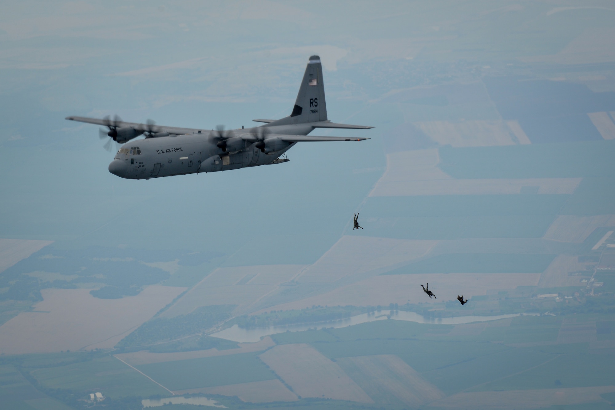 U.S. and Bulgarian paratroopers jump from a C-130J Super Hercules during a halo jump over Plovdiv, Bulgaria, July 14, 2015. During the three-hour formation flight, which consisted of two U.S. Air Force C-130Js and one Bulgarian air force C-27, more than 50 paratroopers exited the aircraft and landed near Plovdiv Airport. (U.S. Air Force photo/Senior Airman Nicole Sikorski)