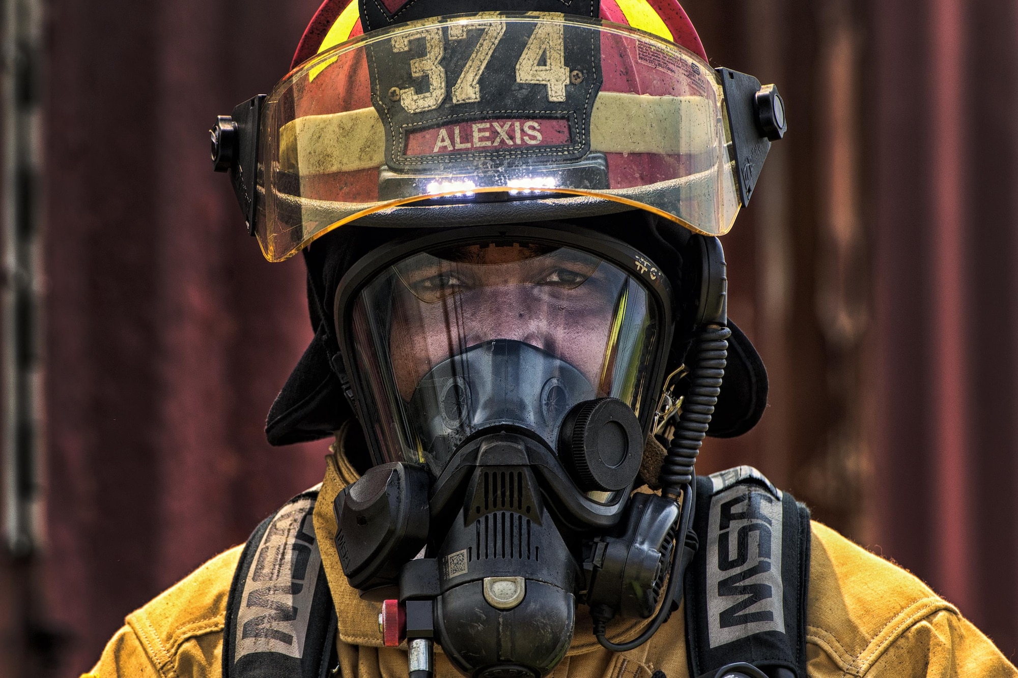 Staff Sgt. Trevor Alexis, the 374th Civil Engineer Squadron fire protection NCO in charge of training, waits to enter a flashover trainer Aug. 4, 2015, at Yokota Air Base, Japan. Flashover, a near-simultaneous ignition of many objects in a confined room, creates a dangerous situation where both heat and smoke continue to increase until combustion. Simulating a flashover fire in a confined room with limited ventilation enables a trainer to educate and prepare firefighters to recognize and react to a potentially dangerous situation. (U.S. Air Force photo/Airman 1st Class Delano Scott)