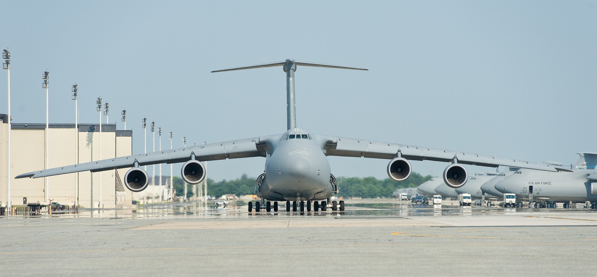 A C-5M Super Galaxy taxies down the flightline prior to takeoff Aug. 17, 2015, at Dover Air Force Base, Del. Eighteen C-5Ms are assigned to Dover AFB. (U.S. Air Force photo/Roland Balik)