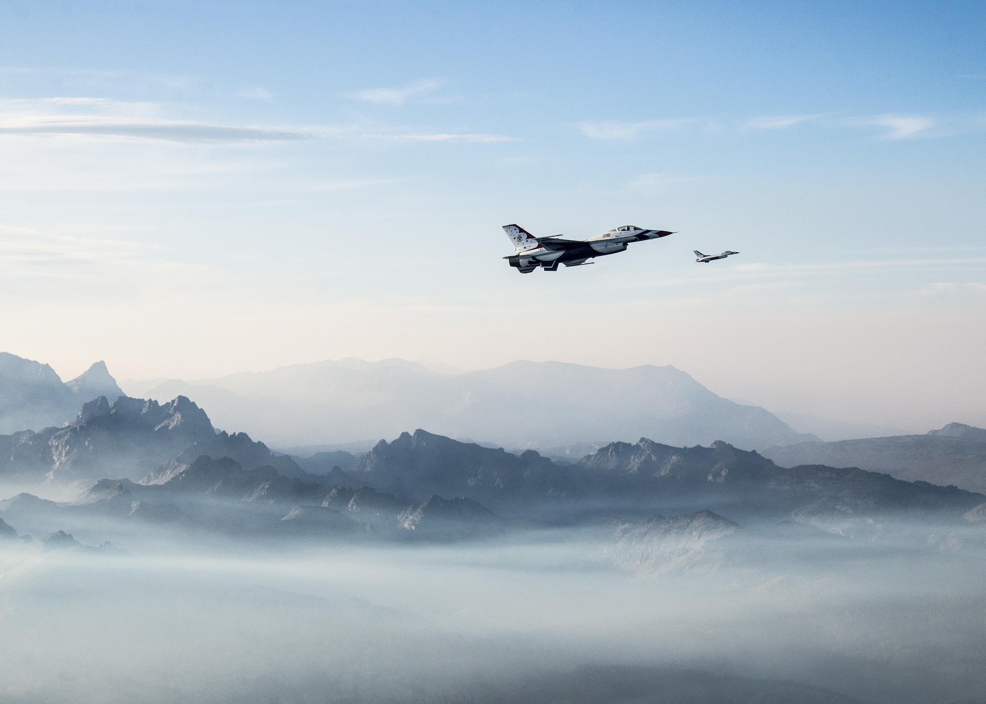 Maj. Jason Curtis, Thunderbird 5, and Capt. Nicholas Eberling, Thunderbird 6, fly back from Minden, Nev., Aug. 25, 2015. (U.S. Air Force photo/Senior Airman Jason Couillard)