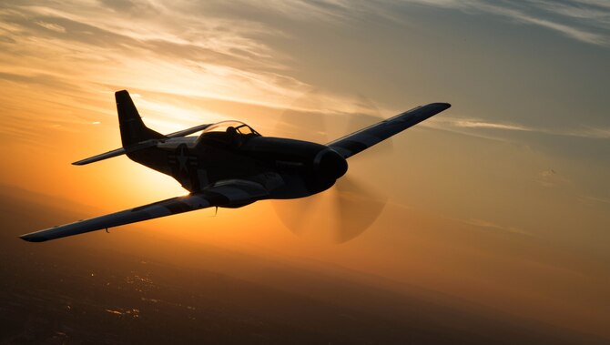 A P-51 Mustang flies over Joint Base Anacostia-Bolling, Washington, D.C., during a military tattoo Sept. 16, 2015. (U.S. Air Force photo/Airman 1st Class Philip Bryant)