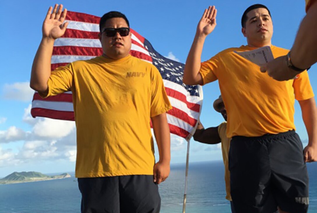LS1 Roberto Lucero and LS2 Jamey Smith of DLA Maritime Pearl Harbor Maritime re-enlisted at the top of Lanikai Pillbox atop Ka'Iwa Ridge this December