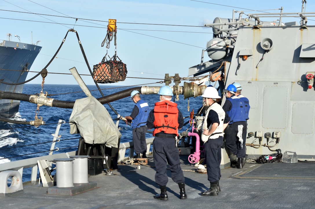 U.S. sailors aboard the USS Ross watch supplies transfer during a replenishment at sea with the Military Sealift Command fleet replenishment oiler USNS Leroy Grumman in the Mediterranean Sea Jan. 5, 2016. U.S. Navy photo by Petty Officer 2nd Class Justin Stumberg