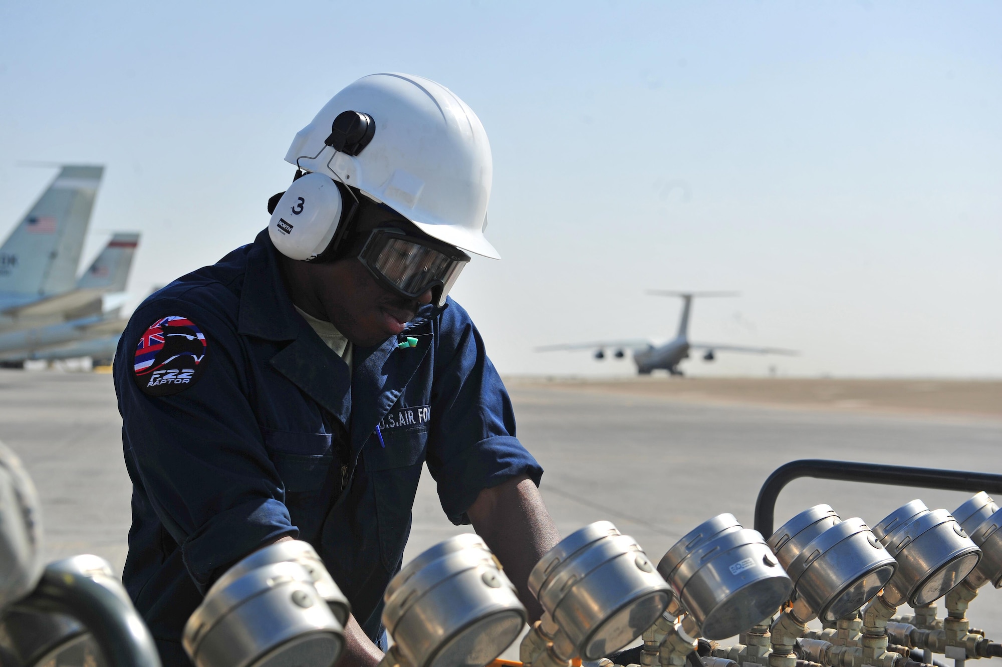 Senior Airman Gregory, a 380th Expeditionary Maintenance Squadron crash recovery team member, checks multiple air pressure dials as part of a mock-aircraft recovery during a major accident response exercise at an undisclosed location in Southwest Asia, Jan. 5, 2016. This particular exercise consisted of multiple agencies from the 380th Air Expeditionary Wing responding to a mock-ground emergency when an aircraft’s nose landing gear collapsed upon landing, causing the jet to veer off the runway and collide with a government vehicle. 
(U.S. Air Force photo by Staff Sgt. Kentavist P. Brackin/Released)
