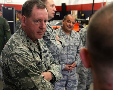 Maj. Gen. James Hecker, 19th Air Force commander, listens to the 149th Fighter Wing munitions flight chief, talk about location limitations during his visit Dec. 10, 2015, to Joint Base San Antonio-Lackland, Texas. The general took time to stop by several base units and listen to various members brief the commander about their work section.