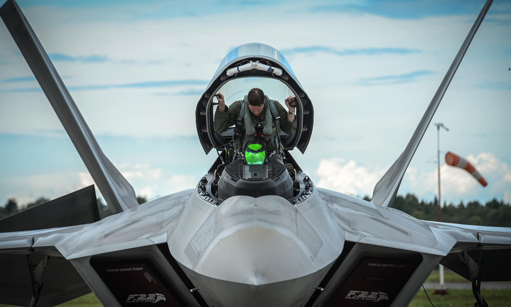 An F-22 pilot from the 95th Fighter Squadron based out of Tyndall Air Force Base, Fla., gets situated in his aircraft prior to taking off from Amari Air Base, Estonia, Sept. 4, 2015, during a brief forward deployment. The F-22s have previously deployed to both the Pacific and Southwest Asia for Airmen to train in a realistic environment while testing partner nations' ability to host advanced aircraft like the F-22. (U.S. Air Force photo/ Tech. Sgt. Ryan Crane)