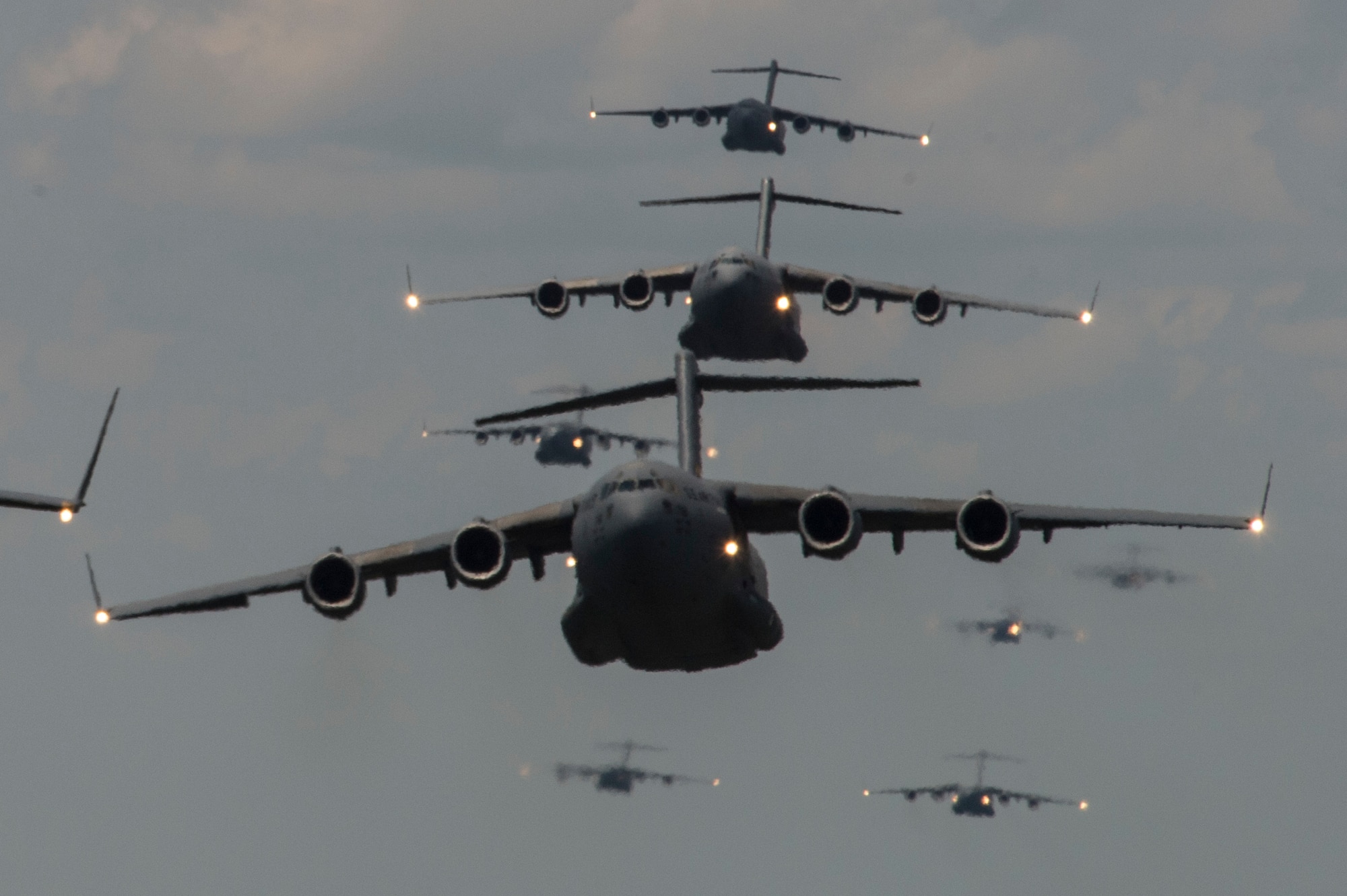 Members of the 437th Airlift Wing at Joint Base Charleston, S.C., conduct a multi-ship C-17 Globemaster III formation during Crescent Reach 15 on May 21, 2015. The exercise tested and evaluated JB Charleston's ability to launch a large aircraft formation in addition to processing and deploying duty passengers and cargo in response to a simulated crisis abroad. (U.S. Air Force photo/Staff Sgt. Corey Hook)