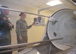 Col. Michael Richards and Staff Sgt. Maribel Cortez, 59th Hyperbaric Medicine Flight, communicate with patients undergoing treatment in the multi-place hyperbaric chamber Nov. 18, 2015, at the Wilford Hall Ambulatory Surgical Center, Joint Base San Antonio-Lackland, Texas. Patients are closely monitored during each dive by technicians and doctors, both inside and out of the chamber, to ensure patient safety at all times. Richards is the flight commander and Cortez is a hyperbaric medical technician. (U.S. Air Force photo by Tech. Sgt. Christopher Carwile)