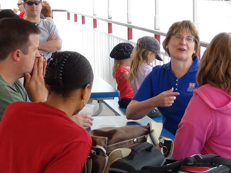 A natural communicator, Maggie Oldham enjoys conversations with her fellow co-workers. 