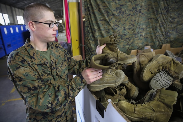 Private Tristan A. McGonagill, Golf Company, 2nd Recruit Training Battalion, puts used boots into a bin during his company’s gear de-issue at Marine Corps Recruit Depot San Diego, Jan. 5. Following graduation from recruit training, McGonagill will move on to the School of Infantry in Camp Pendleton, Calif., and then on to his military occupational specialty school as an amphibious assault vehicle crewman. He hopes to make a career out of the Marine Corps. McGonagill is a native of Bellville, Texas, and was recruited out of Recruiting Station Houston. 
