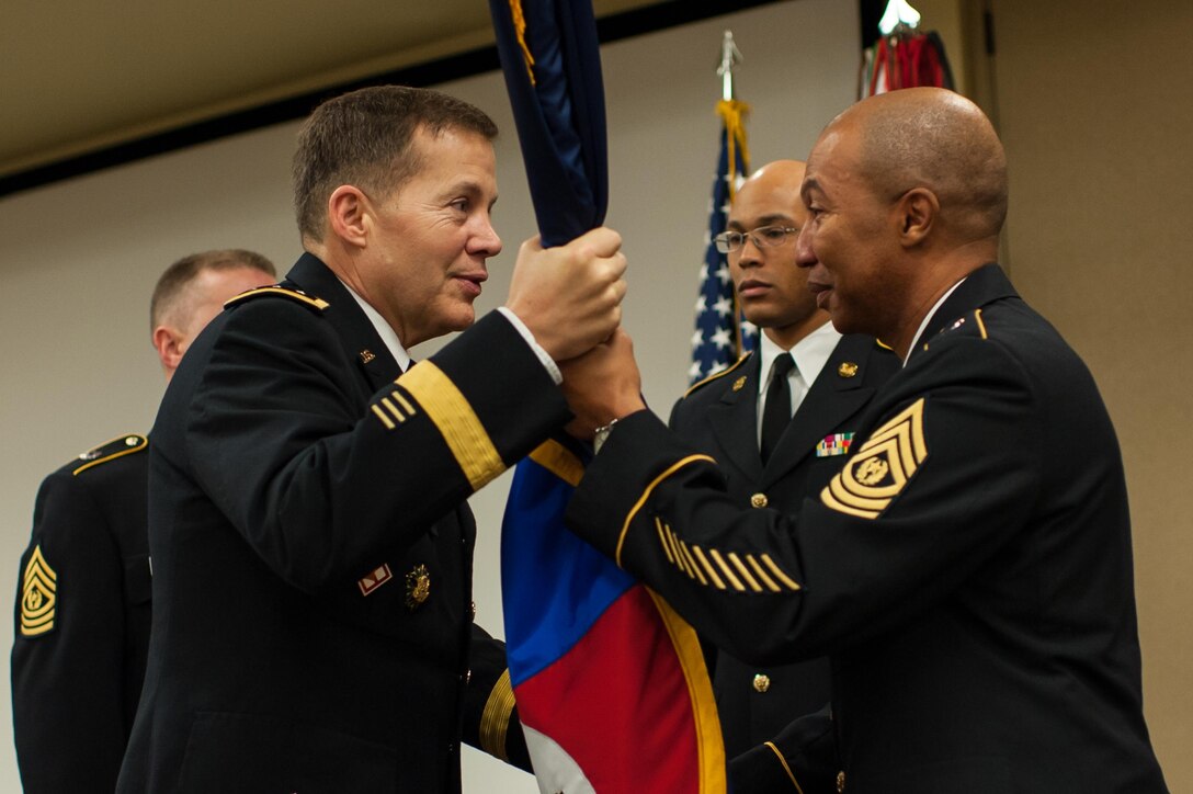 Command Sgt. Maj. Luther Thomas Jr., right, hands over the colors to Lt. Gen. Jeffrey W. Talley, chief U.S. Army Reserve and U.S. Army Reserve Command commanding general, during a change of responsibility ceremony at the U.S. Army Forces Command and U.S. Army Reserve Command headquarters, Jan. 8, 2016, at Fort Bragg, N.C. Thomas leaves USARC to become the senior enlisted adviser to the assistant secretary of defense for Manpower and Reserve Affairs. (U.S. Army photo by Timothy L. Hale/Released)
