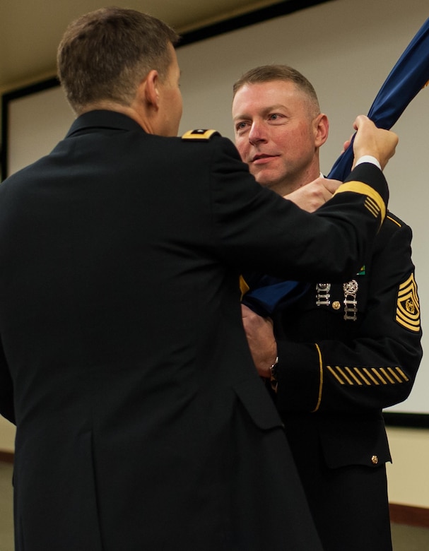 Command Sgt. Maj. James P. Wills, accepts the colors from Lt. Gen. Jeffrey W. Talley, chief U.S. Army Reserve and U.S. Army Reserve Command commanding general, during a change of responsibility ceremony at the U.S. Army Forces Command and U.S. Army Reserve Command headquarters, Jan. 8, 2016, at Fort Bragg, N.C. Wills takes over the U.S. Army Reserve's top enlisted position from Command Sgt. Maj. Luther Thomas Jr. who will be the senior enlisted adviser to the assistant secretary of defense for Manpower and Reserve Affairs. (U.S. Army photo by Timothy L. Hale/Released)