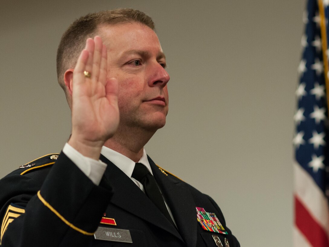 Command Sgt. Maj. James P. Wills takes the oath of office during a change of responsibility ceremony at the U.S. Army Forces Command and U.S. Army Reserve Command headquarters, Jan. 8, 2016, at Fort Bragg, N.C. Wills takes over the U.S. Army Reserve's top enlisted position from Command Sgt. Maj. Luther Thomas Jr., who will be the senior enlisted advisor to the assistant secretary of defense for Manpower and Reserve Affairs. (U.S. Army photo by Timothy L. Hale/Released)