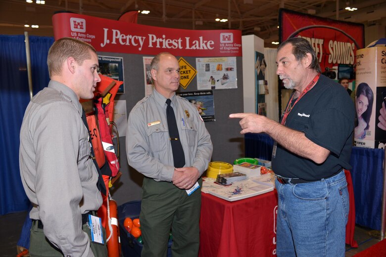 U.S. Army Corps of Engineers Nashville District Park Rangers Brent Sewell and Dave Funderburk from the Old Hickory Lake talk to boat captain,  Kirk Fonte from Nashville at the 30th annual Nashville Boat & Sportshow on Thursday, Jan. 7, 2016 in Music City Center.  