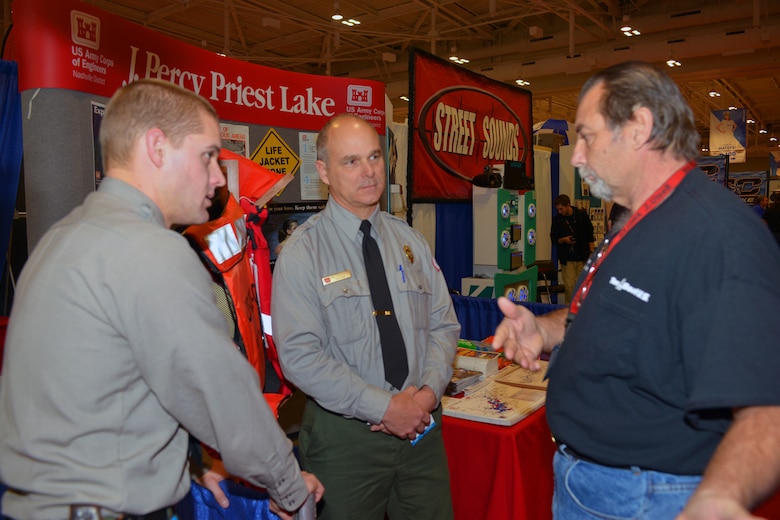 U.S. Army Corps of Engineers Nashville District Park Rangers Brent Sewell and Dave Funderburk from the Old Hickory Lake talk to boat captain,  Kirk Fonte from Nashville at the 30th annual Nashville Boat & Sportshow on Thursday, Jan. 7, 2016 in Music City Center.  