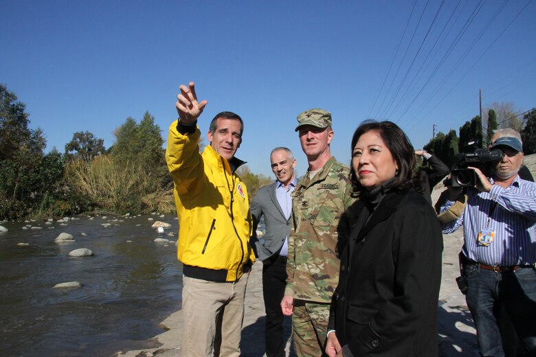 Los Angeles Mayor Eric Garcetti discusses channel capacity with U.S. Army Corps of Engineers Los Angeles District Commander Col. Kirk Gibbs and Los Angeles County Supervisor Hilda Solis at a press conference Jan. 8 that followed the first El Nino storms to hit the Los Angeles area this season. Gibbs joined Garcetti and Solis at the conference to announce the Corps will begin interim risk reduction measures to improve flood protection on the Los Angeles River during El Niño. The District received emergency funding to begin work Jan. 11 on an area of the river that spans from Griffith Park to Elysian Valley.