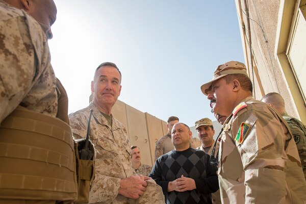 U.S. Marine Corps Gen. Joseph F. Dunford Jr., center left, chairman of the Joint Chiefs of Staff, listens to Marine Col. David Coconut, left, during a group discussion with Iraqi commanders on Al Asad Air Base, Iraq, Jan. 8, 2016. Dunford met with U.S. and coalition leaders to assess progress in the Counter-ISIL efforts. DoD photo by Navy Petty Officer 2nd Class Dominique A. Pineiro