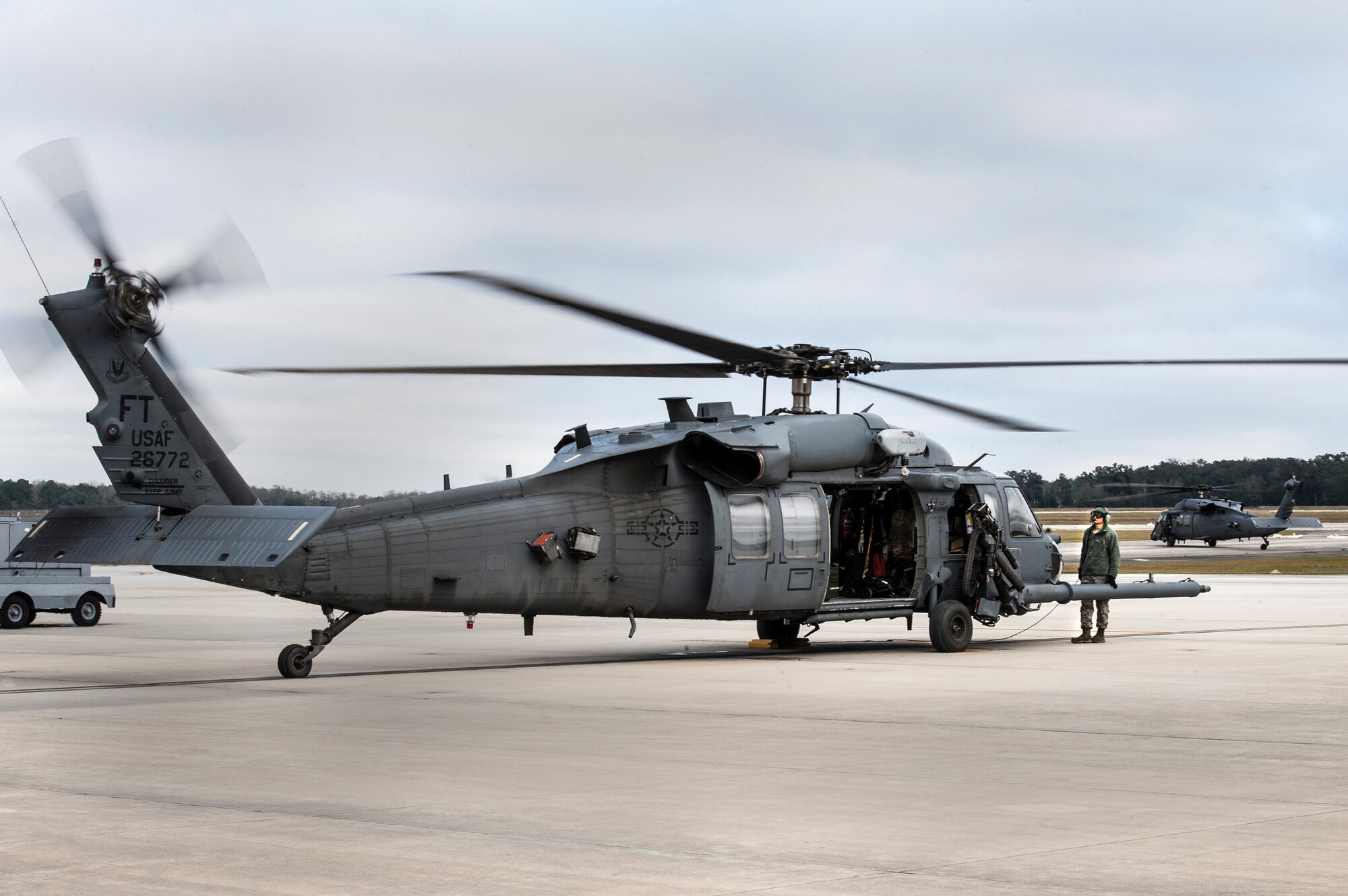 U.S. Air Force Airman 1st Class Igor Ganchenko, 41st Helicopter Maintenance Unit crew chief, prepares an HH-60G Pave Hawk for take-off, Jan. 6, 2016, at Moody Air Force Base, Ga. The 41st HMU ensures helicopters are equipped and ready for the 41st Rescue Squadron to accomplish their search and rescue operations. (U.S. Air Force photo by Airman 1st Class Lauren M. Johnson/Released)