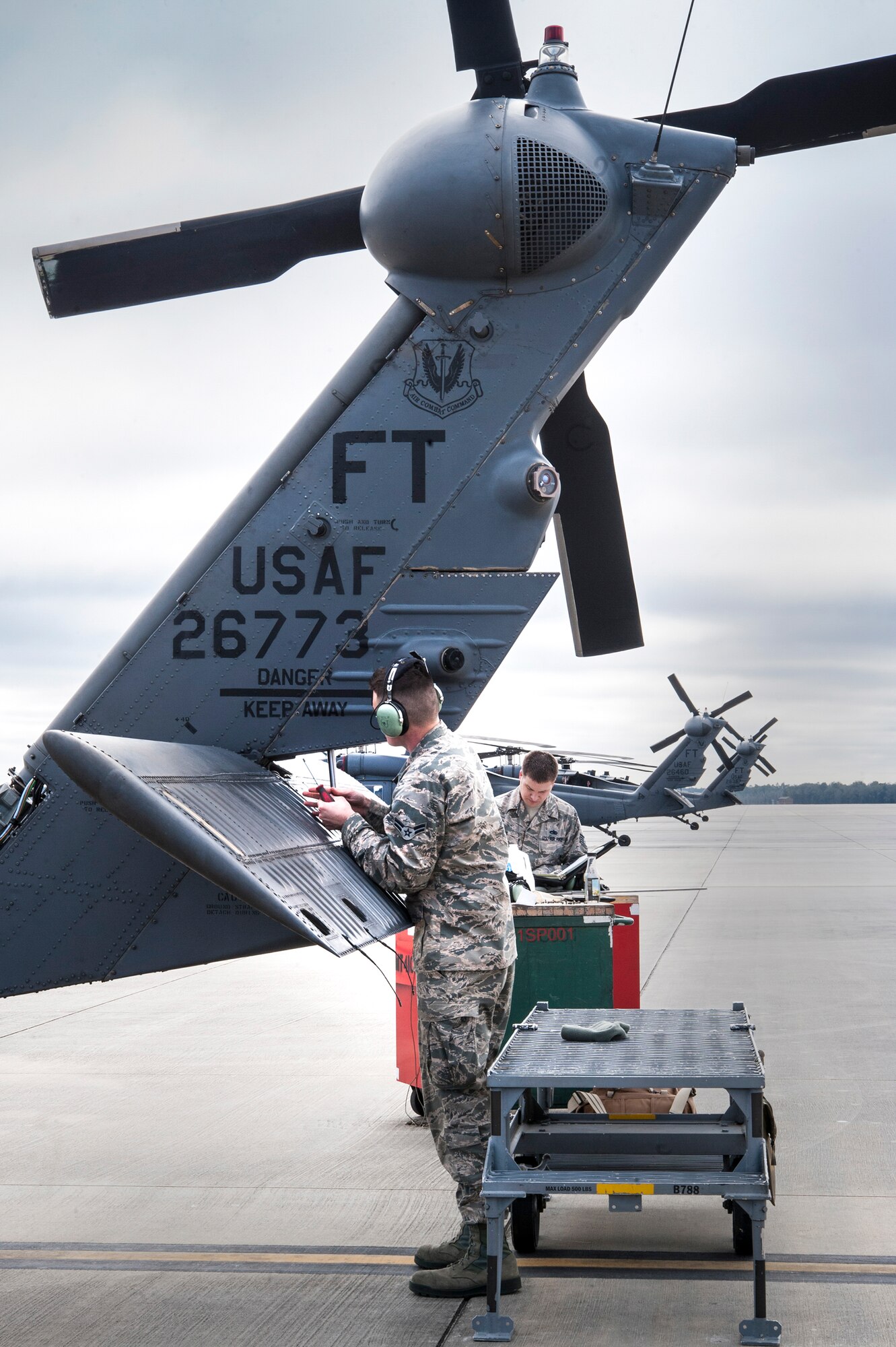 U.S. Air Force Airman 1st Class Derek Fischer, 41st Helicopter Maintenance Unit, repairs the tail stabilator of an HH-60G Pave Hawk, Jan. 6, 2016, at Moody Air Force Base, Ga. The tail stabilator is used for shipboard operations and improves the steering of the helicopter. (U.S. Air Force photo by Airman 1st  Class Lauren M. Johnson/Released)