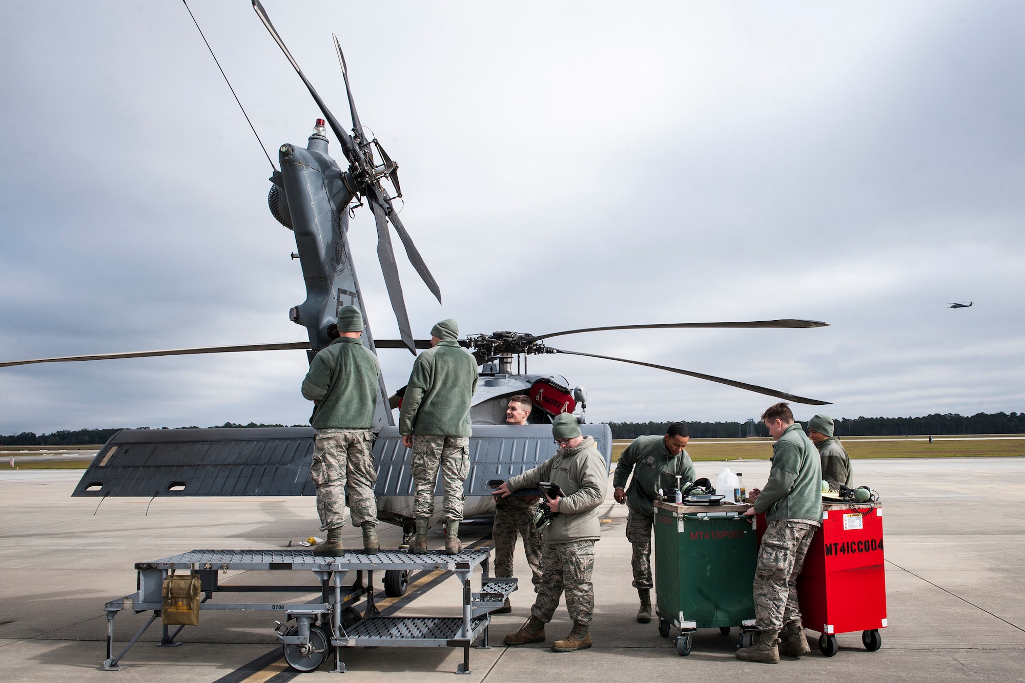 Airmen from the 41st Helicopter Maintenance Unit repair the tail stabilator of an HH-60G Pave Hawk, Jan. 6, 2016, at Moody Air Force Base, Ga. The 41st HMU HH60Gs to fulfill operations of the 41st Rescue Squadron such as search and rescue, medical evacuation, disaster response and humanitarian assistance. (U.S. Air Force photo by Airman 1st Class Lauren M. Johnson/Released)