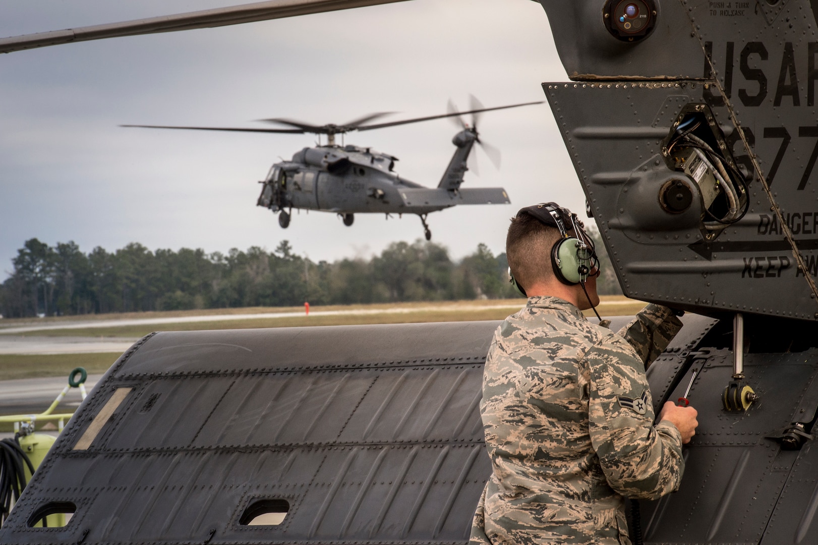 An Airman from the 41st Helicopter Maintenance Unit attaches a panel to the tail of an HH-60G Pave Hawk, Jan. 7, 2016, at Moody Air Force Base, Ga. The 41st HMU works 24/7 to ensure aircraft are ready to fly at a moment’s notice. (U.S. Air Force photo by Senior Airman Ryan Callaghan/Released)


