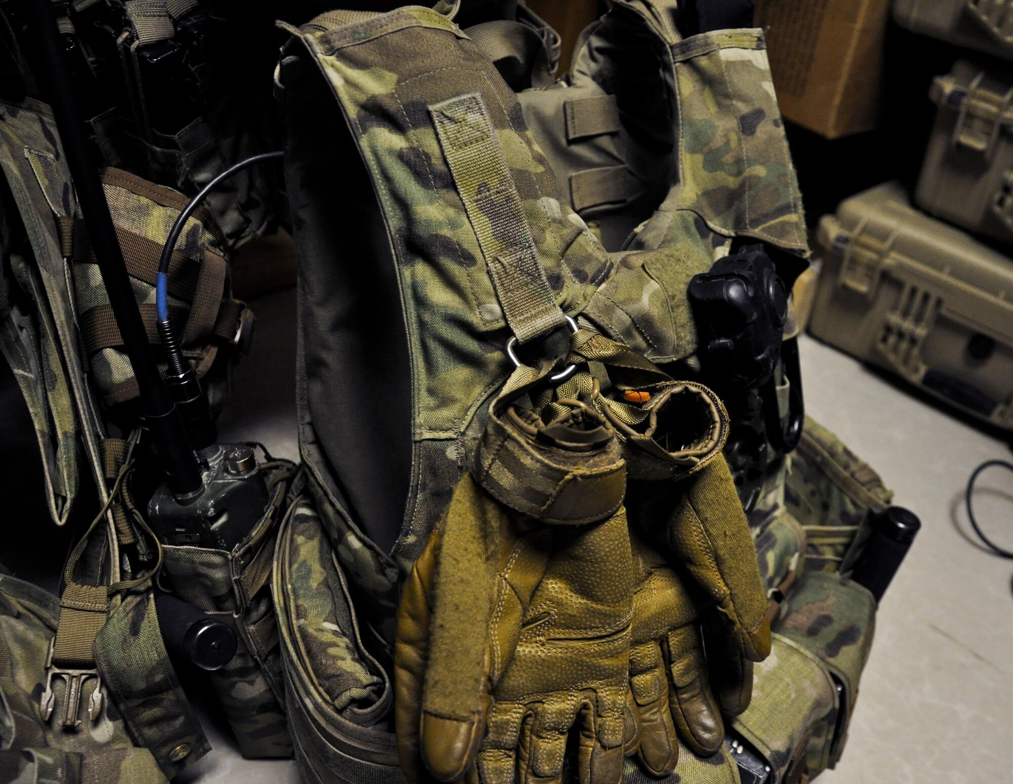 The 455th Expeditionary Security Forces Squadron Fly Away Security Team gear is readied during a pre-mission briefing before a flight to Jalalabad Airfield, Afghanistan Dec. 18, 2015. The 455th ESFS FAST is the all-encompassing security team that provides ground safety and cockpit denial to protect the aircraft and crew. (U.S. Air Force photo by Tech. Sgt. Nicholas Rau)