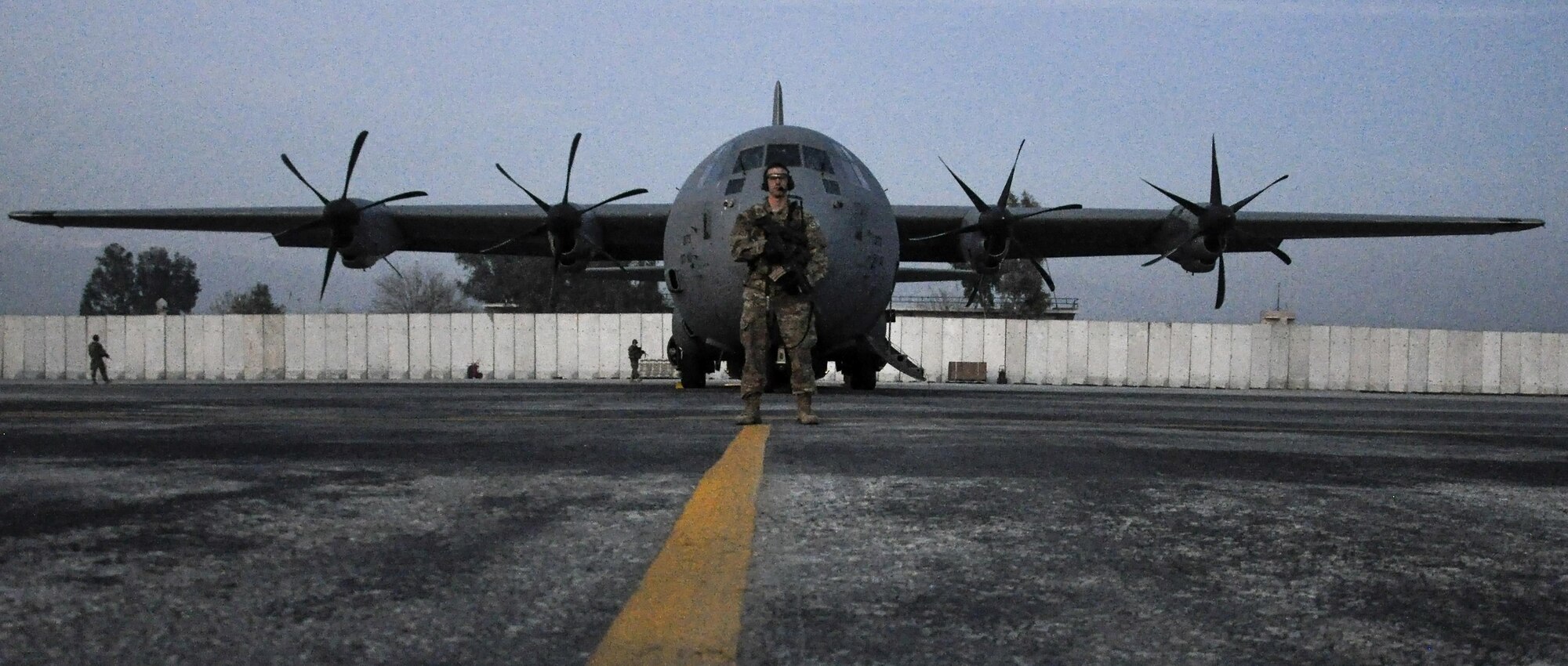 Staff Sgt. Tyler Berogan, 455th Expeditionary Security Forces Squadron Fly Away Security Team squad lead, deployed from Offutt Air Force Base, Neb., secures a C-130 Hercules during a mission to Jalalabad Airfield, Afghanistan Dec. 18, 2015. The 455th ESFS FAST is the all-encompassing security team that provides ground safety and cockpit denial to protect the aircraft and crew. (U.S. Air Force photo by Tech. Sgt. Nicholas Rau)