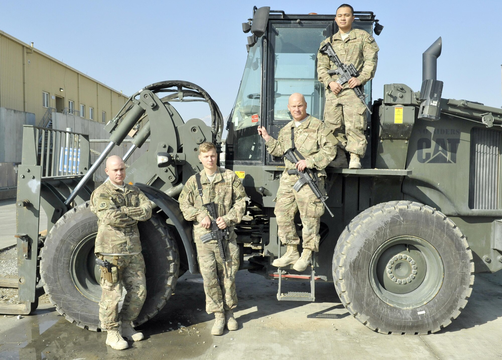 (From left to right) Tech. Sgt. Chad Huggins, Staff Sgt. Tobi Wagner, Master Sgt. Matthew Longshaw and Airman 1st Class John MIchael Aradanas, 455th Expeditionary Logistics Readiness Squadron, were at Hamid Karzai International Airport in Kabul when a vehicle-borne improvised explosive device detonated. The team stepped in to lend a hand in caring for the wounded. (U.S. Air Force photo by Capt. Bryan Bouchard) 