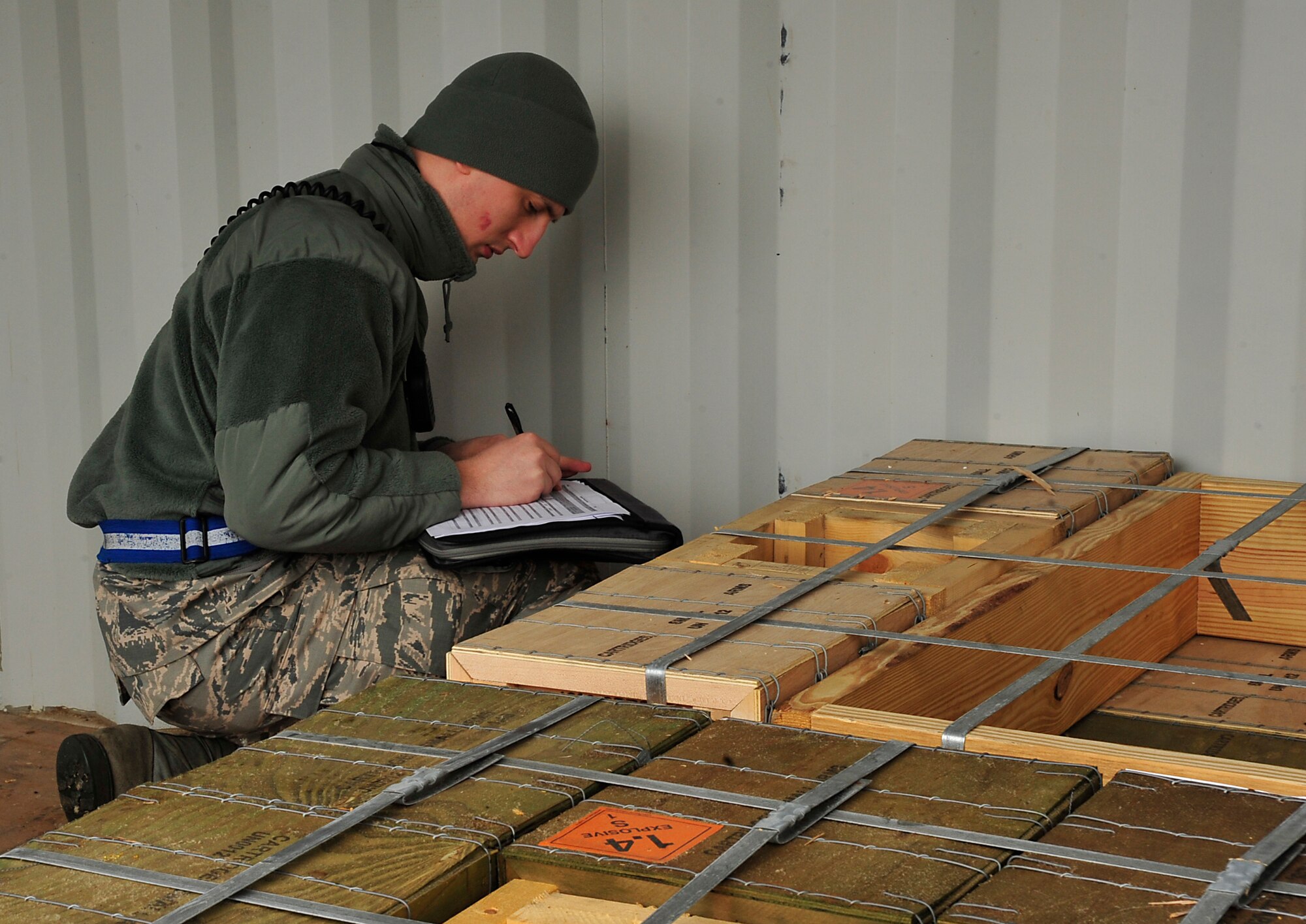 Senior Airman Nathan Slagle, 86th Munitions Squadron munitions storage crew chief, takes accountability of explosives and checks for vulnerabilities on an artillery delivery Dec. 8, 2015, at Ramstein Air Base, Germany. The 86th MUNS provides “the lethal edge” to combatant commands around the world. (U.S. Air Force photo/Airman 1st Class Larissa Greatwood)