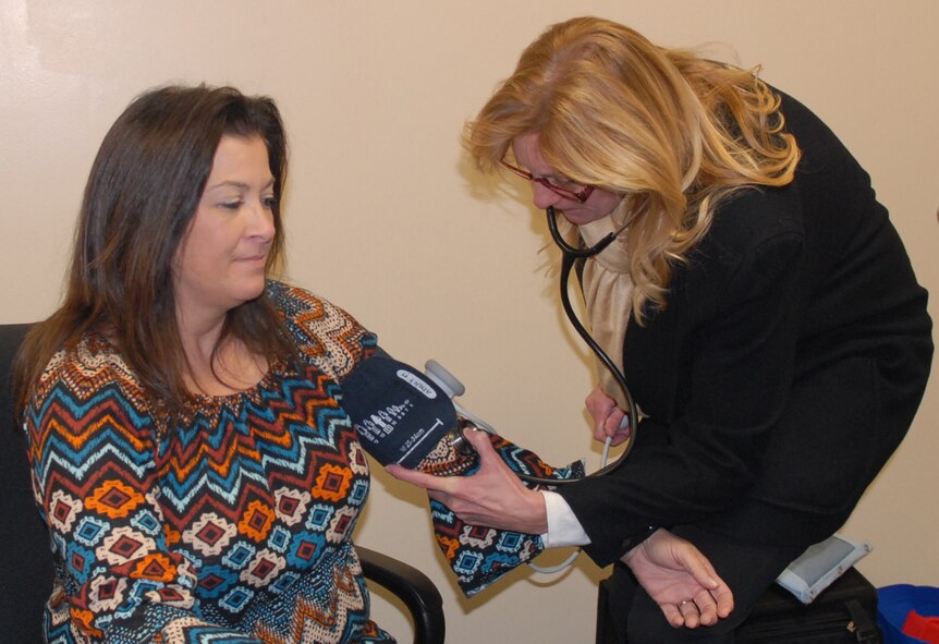 Michelle Eddins, 78th Air Base Wing protocol specialist, has her blood pressure measured by Kim Lopez, Civilian Health Promotion Services specialist, following a “Freeze the Gain with DASH Diet Class”, Jan. 6, 2016. Freeze the Gain is an Air Force Materiel Command weight maintenance program that encourages participants to maintain – not gain – weight during the eight-week challenge period, which runs through Jan. 8. The participants will come back for their final weigh-out to receive an award between Jan 11 and 21. (U.S. Air Force photo by Misuzu Allen)