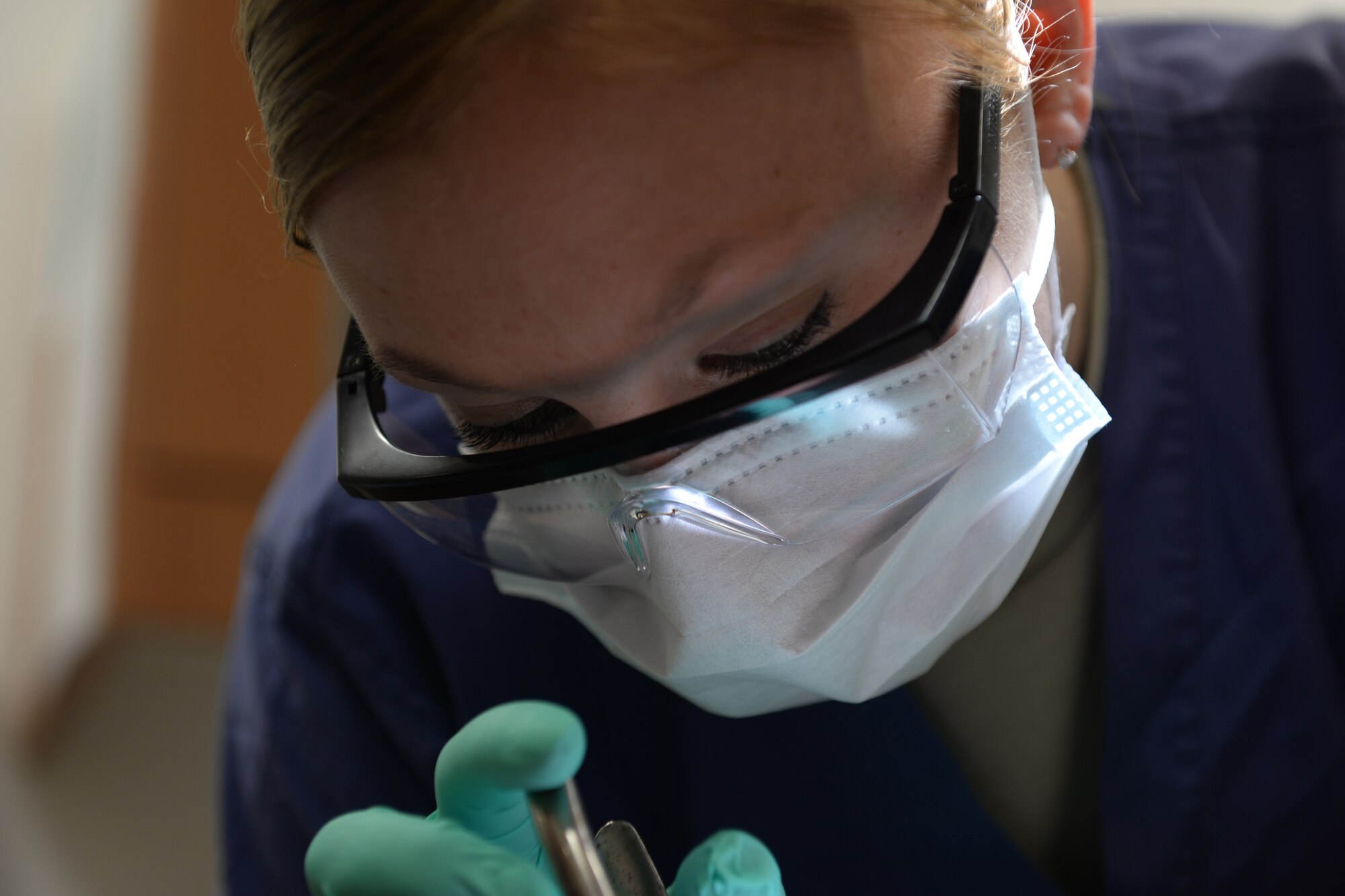 Senior Airmen Alicia Rosdahl, a dental technician with the 423rd Medical Squadron, makes final adjustments to a patient’s braces to ensure no discomfort is caused by protruding wires, during a checkup at the RAF Alconbury, United Kingdom, Dental Clinic, Jan. 6, 2015. Rosdahl uses her position as a dental technician to gain insight and experience that will help her achieve her goal of one day becoming a dentist. (U.S. Air Force photo by Airman 1st Class Zachary Bumpus/Released)