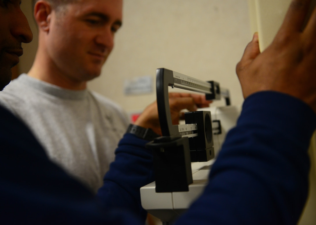 A “The Biggest Winner” participant is weighed at the Dragon Fitness Center at Aviano Air Base, Italy, Jan. 4, 2016.  The “Biggest Winner” competition registration deadline is Jan. 15, 2016. The event is designed to encourage individuals to participate in healthy activities. (U.S. Air Force photo by Staff Sgt. Evelyn Chavez/Released)