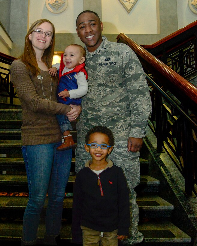 Ann Roberson, her spouse 1st Lt. Quinten Roberson, 51st Comptroller Squadron, and their children, Andrew and Quinten, pose for a photo on Osan Air Base, Republic of Korea, Jan. 8, 2016. The Roberson’s, like many military families, are able to utilize base helping agencies such as the 51st Medical Operation Support Squadron family advocacy office to help maintain a healthy and important balance between military duties and home life. (U.S. Air Force photo/Senior Airman Kristin High)