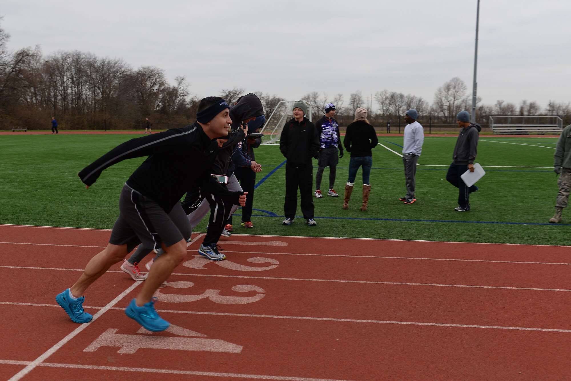 Scott members run during their post-test for Running Clinic, run by Health Promotion, Scott Air Force Base, Illinois, Dec. 17, 2015. Clinics and classes such as Running Clinic, Pain-Free Running class, the Be Well Strength Training class will be starting up in January. (U.S. Air Force photo by Airman 1st Class Erica Holbert-Siebert)
