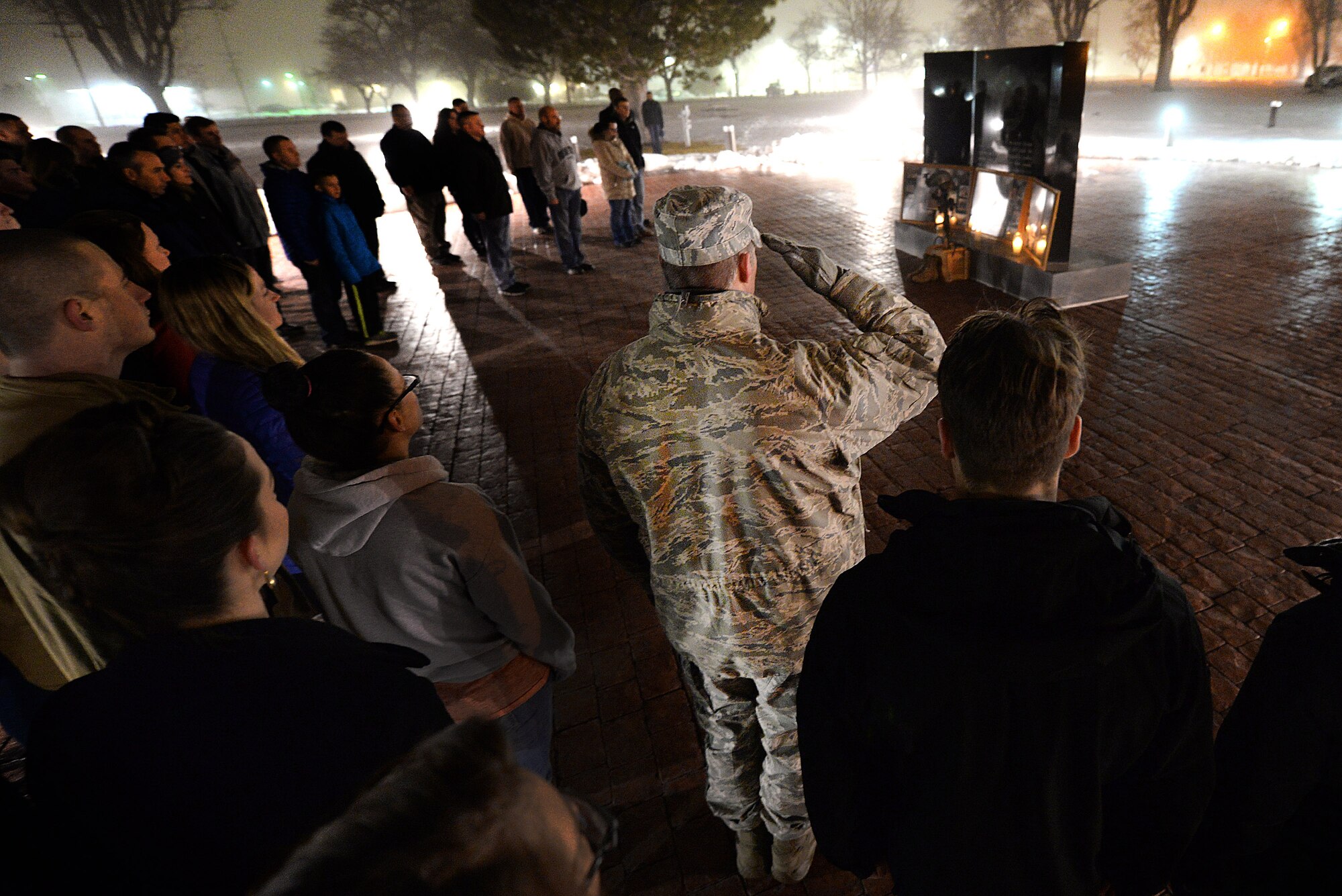 Lt. Col. Hall Sebren, 75th Air Base Wing chief of safety, salutes during the playing of taps for three fallen Airmen Jan. 7 at Hill Air Force Base, Utah. Members of Team Lima from the 775th Civil Engineer Squadron at Hill -- Tech. Sgt. Timothy Weiner, Senior Airman Daniel Miller, and Senior Airman Elizabeth Loncki -- were investigating a vehicle-borne improvised explosive device near Al Mahmudiyah, Iraq, when the device detonated, killing the three Airmen and a U.S. Army Soldier, and injuring another Airman on Jan. 7, 2007. The annual ceremony also included words of remembrance and a moment of silence. (U.S. Air Force photo by Paul Holcomb)