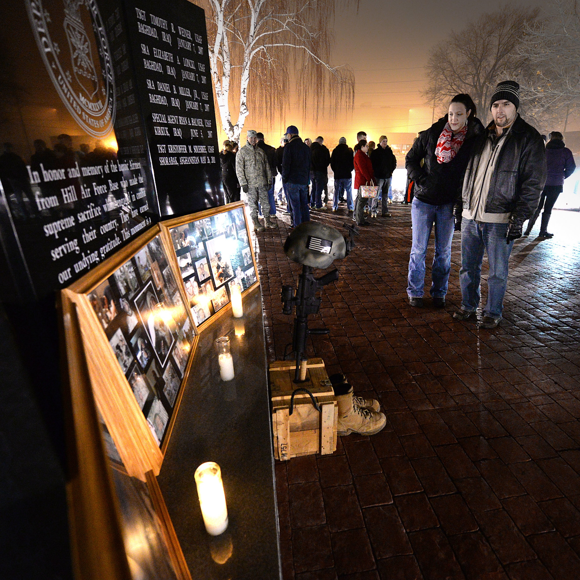 Justin Bavery and Kaitlin Huntsman remember three fallen Airmen Jan. 7 at Hill Air Force Base, Utah. Members of Team Lima from the 775th Civil Engineer Squadron at Hill -- Tech. Sgt. Timothy Weiner, Senior Airman Daniel Miller, and Senior Airman Elizabeth Loncki -- were investigating a vehicle-borne improvised explosive device near Al Mahmudiyah, Iraq, when the device detonated, killing the three Airmen and a U.S. Army Soldier, and injuring another Airman on Jan. 7, 2007. More than 60 paid their respects during the annual ceremony in Memorial Park. (U.S. Air Force photo by Paul Holcomb)