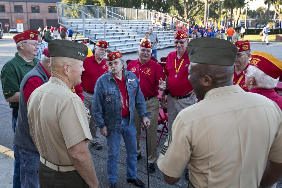 Commandant of the Marine Corps, Gen. Robert B. Neller, left, and Sgt. Maj. of the Marine Corps Ronald L. Green, right, talk to Marine Corps League veterans at Marine Corps Recruit Depot, S.C., Oct. 16, 2015. Neller and Green outlined the Corps current priorities, expectations, listened and answered Marines' questions. (U.S. Marine Corps photo by Sgt. Gabriela Garcia/Released)