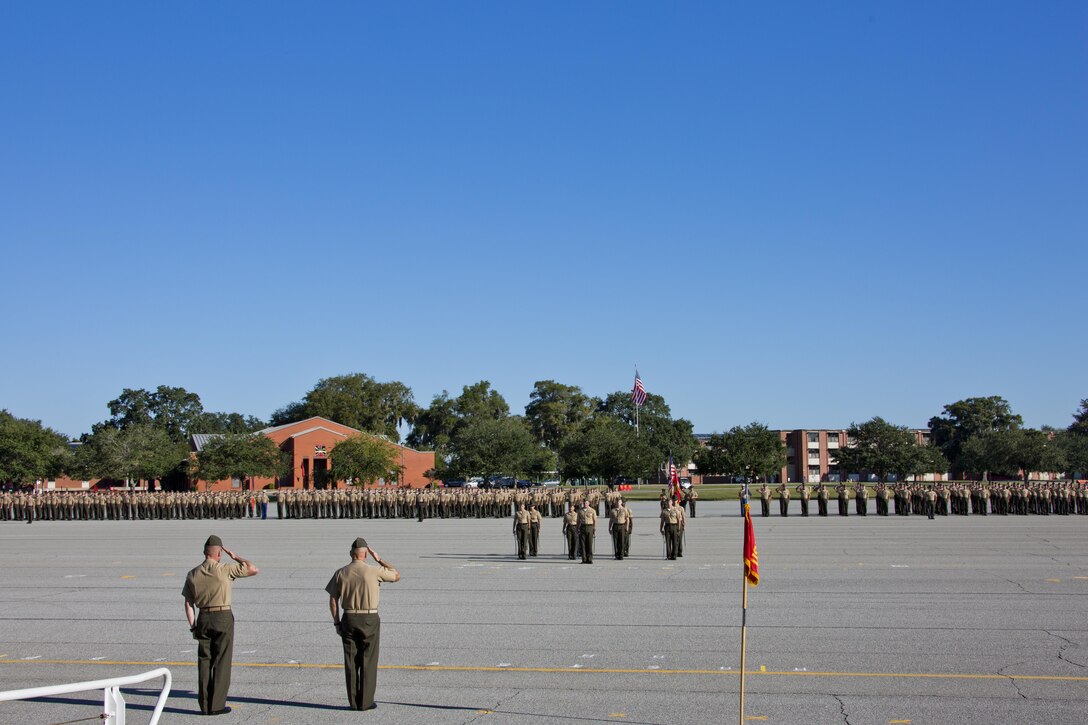 Commandant of the Marine Corps, Gen. Robert B. Neller, second left, salutes during a graduation ceremony at Marine Corps Recruit Depot Parris Island, S.C., Oct. 16, 2015. Neller was the parade reviewing official for the ceremony. (U.S. Marine Corps photo by Sgt. Gabriela Garcia/Released)
