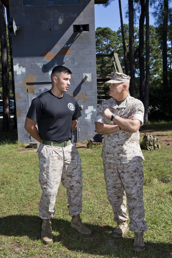 Commandant of the Marine Corps, Gen. Robert B. Neller, right, speaks to a Marine at Marine Corps Recruit Depot Parris Island, S.C., Oct. 16, 2015. Neller visited Marines to outline the Corps' current priorities, expectations, listen and answer questions. (U.S. Marine Corps photo by Sgt. Gabriela Garcia/Released)