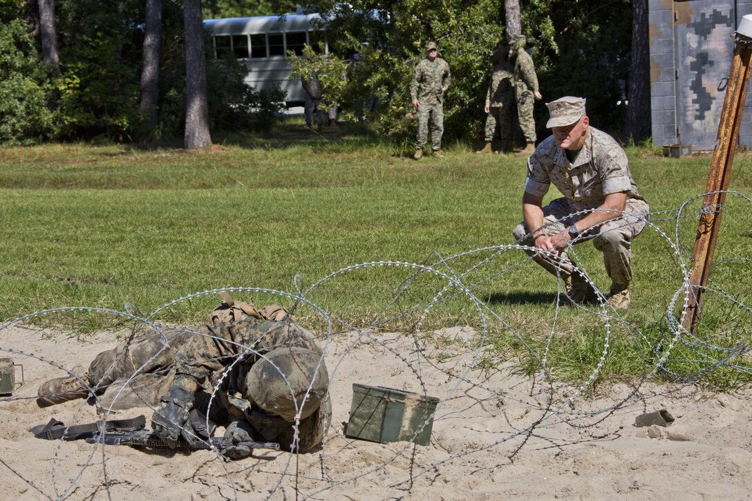 Commandant of the Marine Corps, Gen. Robert B. Neller, observes recruits executing a portion of the crucible at Marine Corps Recruit Depot Parris Island, S.C., Oct. 16, 2015. Neller watched recruits go through one of the toughest parts of their recruit training. (U.S. Marine Corps photo by Sgt. Gabriela Garcia/Released)