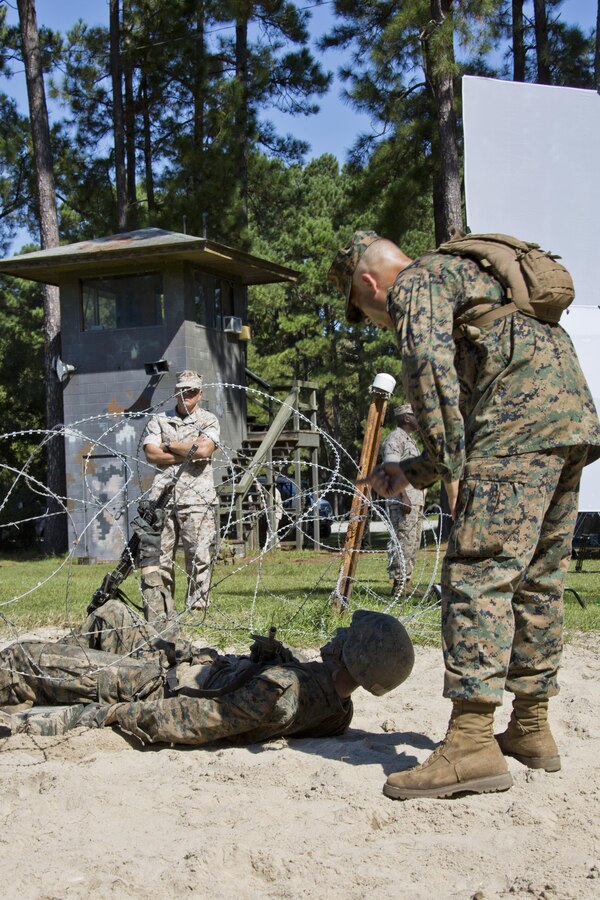 Commandant of the Marine Corps, Gen. Robert B. Neller, observes a Marine participating with recruits during the crucible at Marine Corps Recruit Depot Parris Island, S.C., Oct. 16, 2015. Neller watched recruits go through one of the toughest parts of their recruit training. (U.S. Marine Corps photo by Sgt. Gabriela Garcia/Released)