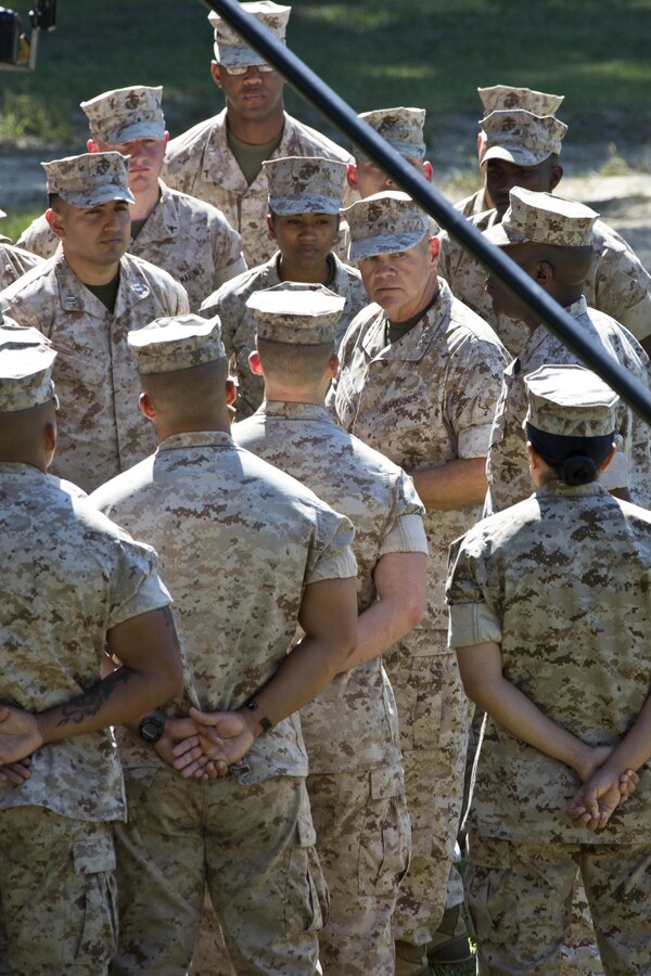 Commandant of the Marine Corps, Gen. Robert B. Neller, center, and Sgt. Maj. of the Marine Corps Ronald L. Green, center right, talk with Marines at Marine Corps Recruit Depot Parris Island, S.C., Oct. 16, 2015. Neller and Green were recorded interacting with Marines as part of the 240th Marine Corps birthday video. (U.S. Marine Corps photo by Sgt. Gabriela Garcia/Released)