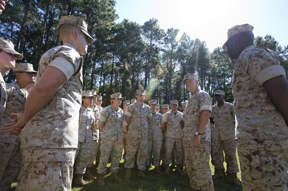 Commandant of the Marine Corps, Gen. Robert B. Neller, center right, and Sgt. Maj. of the Marine Corps Ronald L. Green, right, talk with Marines at Marine Corps Recruit Depot Parris Island, S.C., Oct. 16, 2015. Neller and Green outlined the Corps' current priorities, expectations, listened and answered their questions. (U.S. Marine Corps photo by Sgt. Gabriela Garcia/Released)