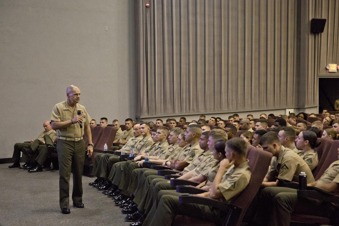 Commandant of the Marine Corps, Gen. Robert B. Neller, left, speaks to Marines at Marine Corps Air Station Beaufort, S.C., Oct. 16, 2015. Neller outlined the Corps' current priorities, expectations, listened and answered questions during his visit. (U.S. Marine Corps photo by Sgt. Gabriela Garcia/Released)