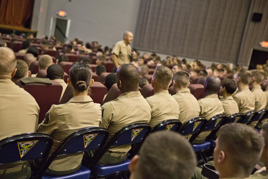 U.S. Marines listen to Commandant of the Marine Corps, Gen. Robert B. Neller, speak at Marine Corps Air Station Beaufort, S.C., Oct. 16, 2015. Neller outlined the Corps' current priorities, expectations, listened and answered questions during his visit. (U.S. Marine Corps photo by Sgt. Gabriela Garcia/Released)