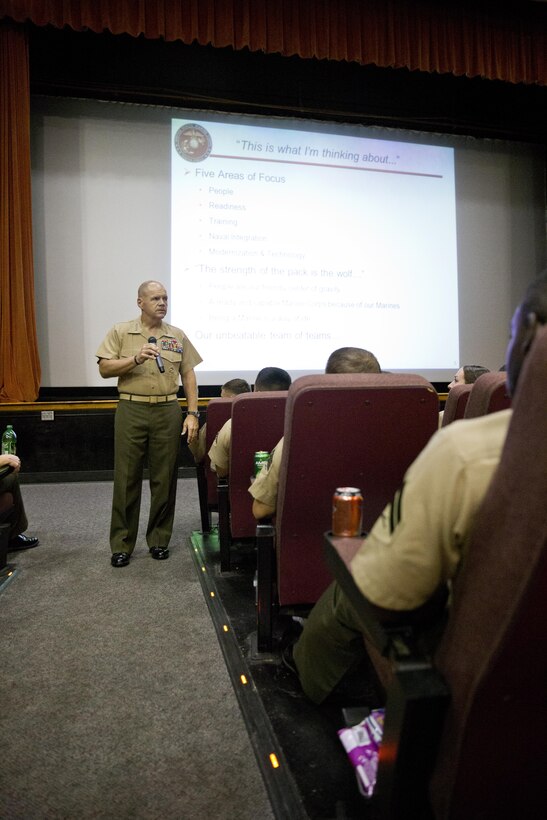 Commandant of the Marine Corps, Gen. Robert B. Neller, left, speaks to Marines at Marine Corps Air Station Beaufort, S.C., Oct. 16, 2015. Neller outlined the Corps' current priorities, expectations, listened and answered questions during his visit. (U.S. Marine Corps photo by Sgt. Gabriela Garcia/Released)