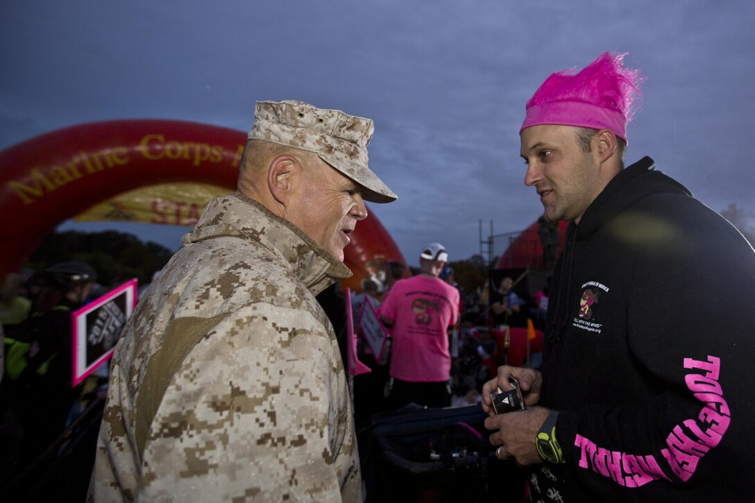 Commandant of the Marine Corps, Gen. Robert B. Neller, talks to a runner before the Marine Corps Marathon at Arlington, Va., Oct. 25, 2015. Over 30,000 runners participated in the 26.2 mile, 40th annual Marine Corps Marathon. (U.S. Marine Corps photo by Sgt. Gabriela Garcia/Released)
