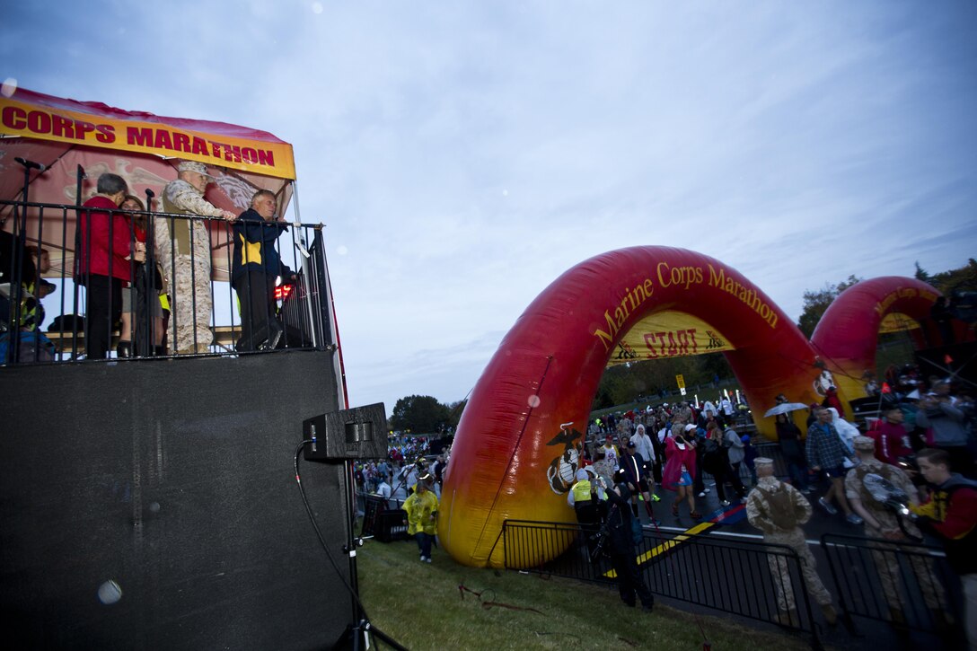 Commandant of the Marine Corps, Gen. Robert B. Neller, and Virginia Governor Terry McAuliffe observe runners before the Marine Corps Marathon at Arlington, Va., Oct. 25, 2015. Over 30,000 runners participated in the 26.2 mile, 40th annual Marine Corps Marathon. (U.S. Marine Corps photo by Sgt. Gabriela Garcia/Released)
