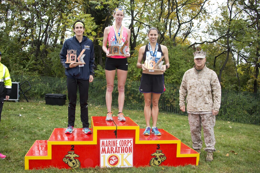 Commandant of the Marine Corps, Gen. Robert B. Neller, poses with the top three women finishers of the Marine Corps Marathon 10k at Arlington, Va., Oct. 25, 2015. Over 30,000 runners participated in the 40th annual Marine Corps Marathon. (U.S. Marine Corps photo by Sgt. Gabriela Garcia/Released)