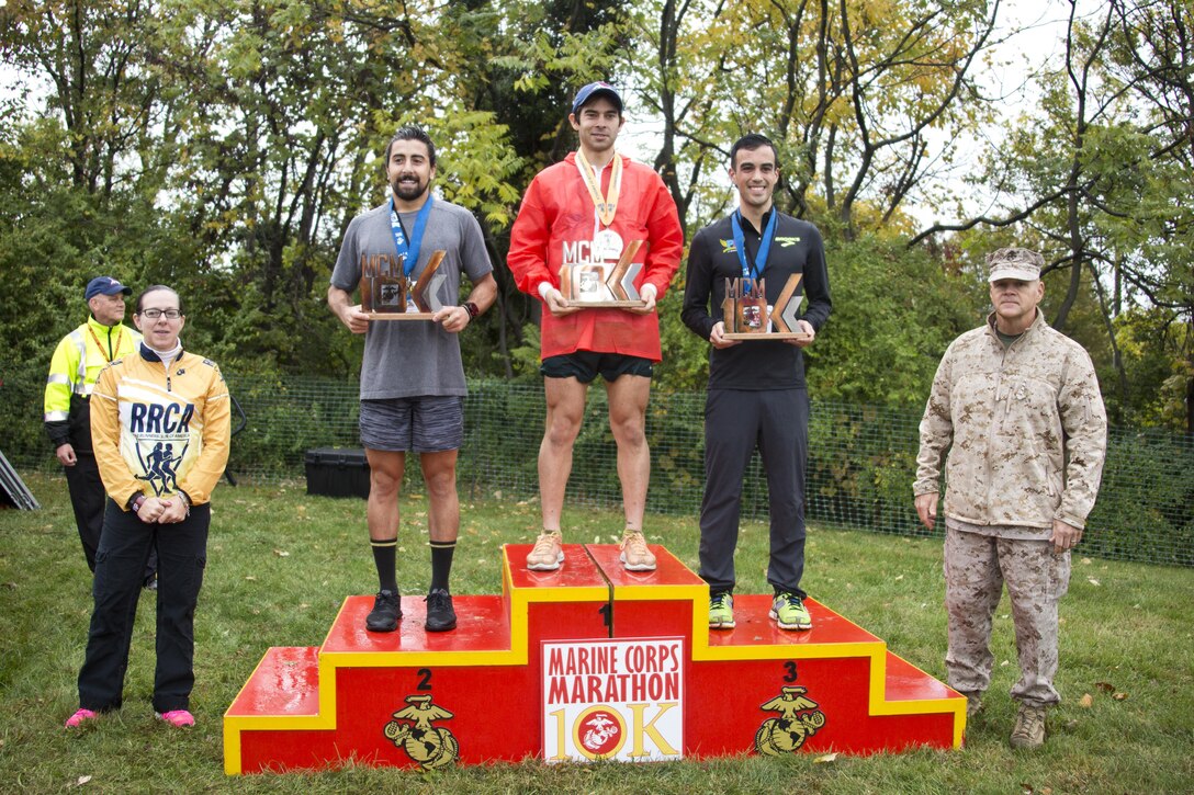 Commandant of the Marine Corps, Gen. Robert B. Neller, poses with the top three men finishers of the Marine Corps Marathon 10k at Arlington, Va., Oct. 25, 2015. Over 30,000 runners participated in the 40th annual Marine Corps Marathon. (U.S. Marine Corps photo by Sgt. Gabriela Garcia/Released)